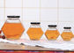 250ml-750mlふた、六角形ガラスが付いているガラス蜂蜜の瓶は明確な色を震動させる